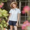 White linen button-down shirt with short sleeves